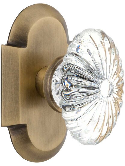 Arched Rosette Door Set with Oval Fluted-Crystal Glass Knobs in Antique Brass.
